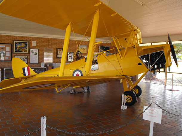 A DH 82 Tiger Moth takes centre stage in the memorial and is  complimented by a collection of photographs, memorabilia & model airplanes.